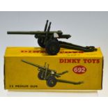 Dinky Toys 5.5 Medium Gun No.692 in good condition with original box (writing on)