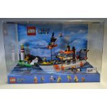 Lego Shop Display featuring Lego City No 60014 Coast Guard Set all house in a plastic display case