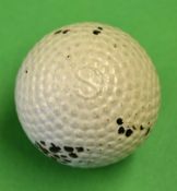 Silvertown Golf Company bramble pattern rubber core golf ball - stamped S to the pole, retaining