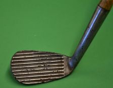 Gibson "The Jerko" corrugated face mashie niblick stamped J Graham & Co Inverness c/w the replaced