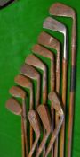 12x various irons - all in need of restoration, most with the original leather/hide grips one with