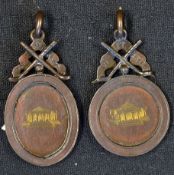 2x 1936 bronzed engraved golfing medals - mounted with crossed golf clubs and banner engraved "VI Et