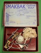 Early "Smakbak Captive Golf" practice aid - in the original box c/w the original Smakbak ball. (G)