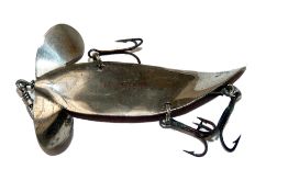 LURE: An early Comet metal lure, 3.25" long swept tail, twin fins, underbelly central bar with three