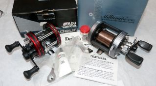 REELS: (2) Abu Ambassadeur 5000 red multiplier reel, foot stamp 05021148, twin handles, star drag,