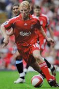 Dirk Kuyt signed photograph in Liverpool colours, overall 35.5 x 45.5cm, mfg.
