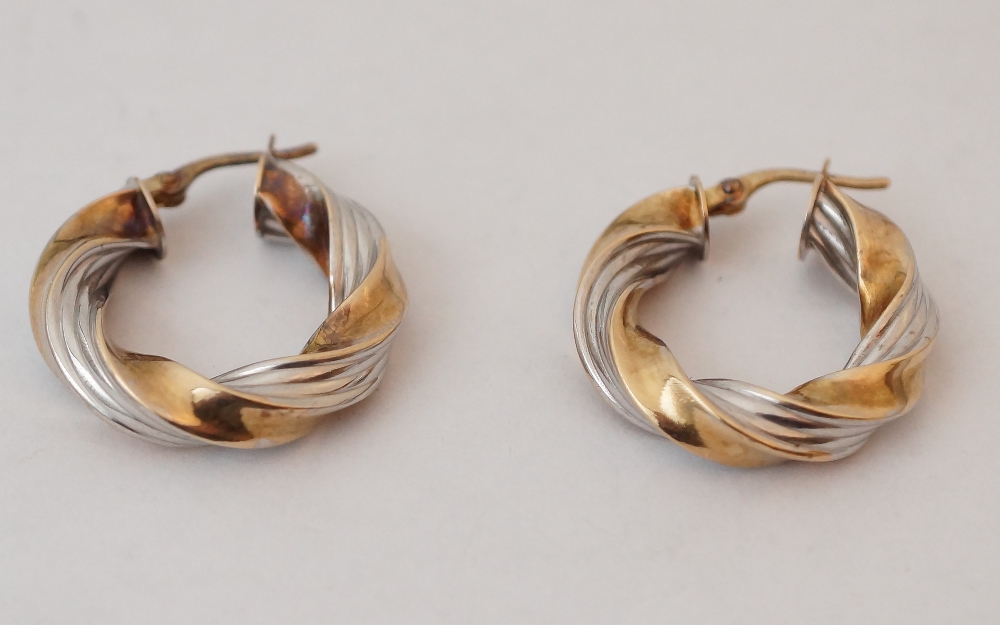 PAIR OF NINE CARAT BI-COLOUR GOLD HOOP E