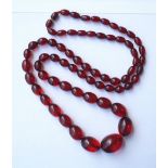 GRADUATED AMBER BEAD NECKLACE
approximately 90cm long and 70 grams