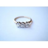 DIAMOND THREE STONE DRESS RING
set in eighteen carat gold, the diamonds totalling approximately 0.