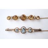 TWO EDWARDIAN GEM SET BROOCHES
one set with aquamarine and seed pearl in fifteen carat gold,