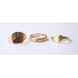 THREE NINE CARAT GOLD RINGS
of various design, one of heart shape with inset diamond,