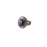 SAPPHIRE AND DIAMOND CLUSTER DRESS RING
the central oval cut sapphire approximately 3.