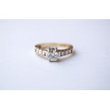 ROUND BRILLIANT CUT DIAMOND RING
the central diamond approximately 0.