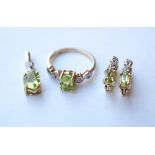 SUITE OF PERIDOT AND DIAMOND JEWELLERY
all in nine carat gold, comprising a pair of earrings,