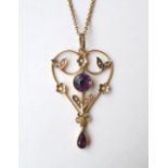 AMETHYST AND SEED PEARL HOLBEIN PENDANT
in nine carat gold,