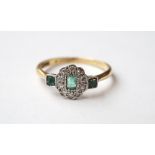 ART DECO DIAMOND AND EMERALD CLUSTER RING
in eighteen carat gold and platinum,