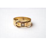 DIAMOND SET BUCKLE DESIGN RING
in eighteen carat gold, total weight approximately 4.