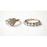 TWO NINE CARAT GOLD CZ SET RINGS
one a seven stone ring and the other with heart shaped setting,