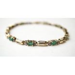 EMERALD AND DIAMOND LINE BRACELET
in nine carat gold,