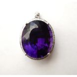 IMPRESSIVE AMETHYST AND DIAMOND CLUSTER PENDANT
the large oval cut amethyst approximately 24cts in