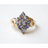 TANZANITE AND DIAMOND CLUSTER DRESS RING
on nine carat gold shank,