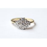 DIAMOND NINE STONE DRESS RING
set in eighteen carat gold, the diamonds totalling approximately 0.