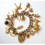 NINE CARAT GOLD CHARM BRACELET
the curb link bracelet with nine carat gold padlock attachment and