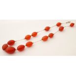 GRADUATED CARNELIAN BEAD NECKLACE
with knife edge bar links,