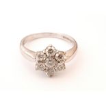 PRETTY DIAMOND CLUSTER RING
the seven round brilliant cut diamonds totalling approximately 1.