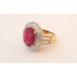 RUBY AND DIAMOND CLUSTER DRESS RING
the large central oval cut ruby approximately 5.