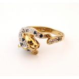DIAMOND AND SAPPHIRE PANTHER DESIGN RING
on nine carat gold shank,