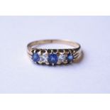 DIAMOND AND SAPPHIRE FIVE STONE RING
on eighteen carat gold shank,