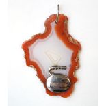 CURLING INTEREST -
a 1970's agate pendant with overlaid silver curling stone profile,