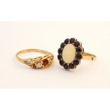 TWO GARNET AND GEM SET DRESS RINGS
one a graduated CZ and garnet five stone ring on nine carat gold