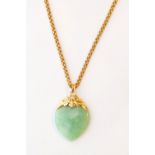 HEART SHAPED JADE PENDANT
in fourteen carat gold mount and on fancy link nine carat gold chain
