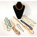 GOOD SELECTION OF BEAD NECKLACES
including an amber coloured bakelite necklace, quartz, malachite,