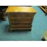 A GEORGIAN STYLE FOUR DRAWER CHEST with