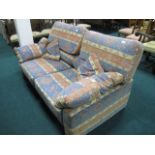 A TWO SEATER SETTEE with loose cushions