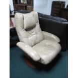 A HIDE UPHOLSTERED SWIVEL CHAIR