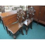 A PAIR OF VICTORIAN MAHOGANY HALL CHAIRS