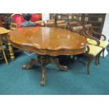 A BURR WALNUT DINING TABLE of serpentine