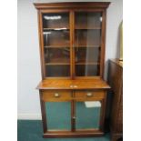 AN EDWARDIAN MAHOGANY BOOKCASE the outse