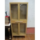 A BEECHWOOD DISPLAY CABINET the moulded