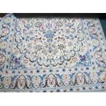 A WOOL RUG the beige ground with overall floral pattern 254cm x 156cm