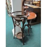 A BENTWOOD WASH STAND of circular form on splayed legs joined by an under tier