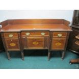 A GEORGIAN MAHOGANY SIDEBOARD of inverted breakfront outline the shaped moulded top with gadrooned