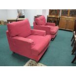 A LARGE PAIR OF WINE UPHOLSTERED EASY CHAIRS with loose cushions 91cm wide