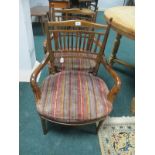 A PAIR OF EDWARDIAN MAHOGANY ELBOW CHAIRS Spanish with cylindrical splats and carved arms with