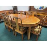 A NINE PIECE ORIENTAL HARDWOOD DINING ROOM SUITE comprising eight chairs including a pair of elbow