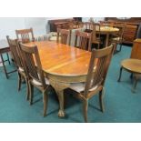 A SEVEN PIECE MAHOGANY DINING ROOM SUITE comprising six dining room chairs each with pierced